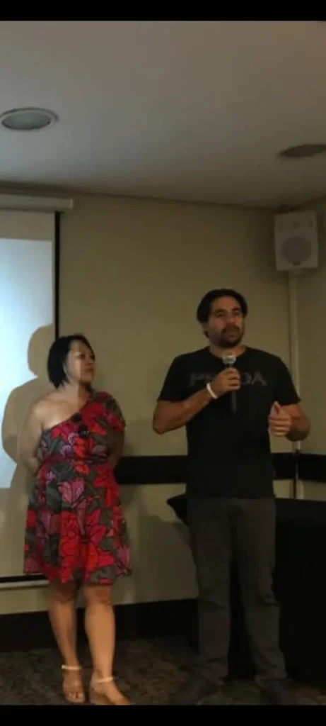 SkyTC founders Valtersky and Marcia Okabe presenting a technology and innovation keynote together on stage.
