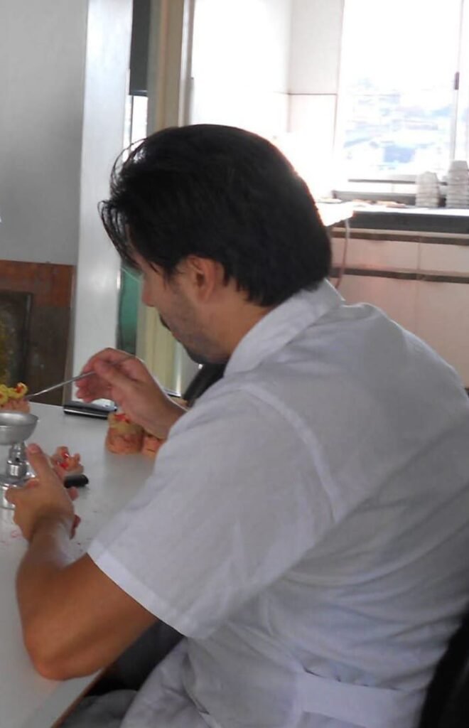 SkyTC founder Valtersky working with high-precision tools in a dental prosthetics laboratory.