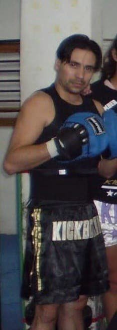 SkyTC founder Valtersky in a kickboxing stance wearing training gear and gloves.